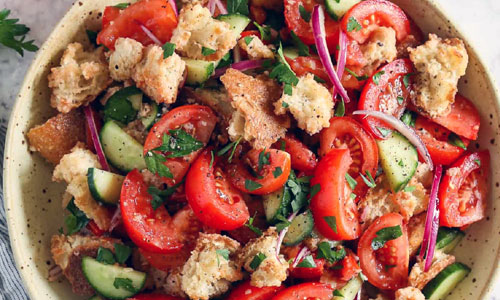 Fresh Panzanella salad mixed in a dish